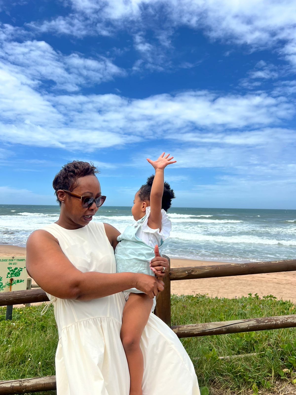 Nompilo Kelly with her two-year-old daughter Rome at the beach in South Africa